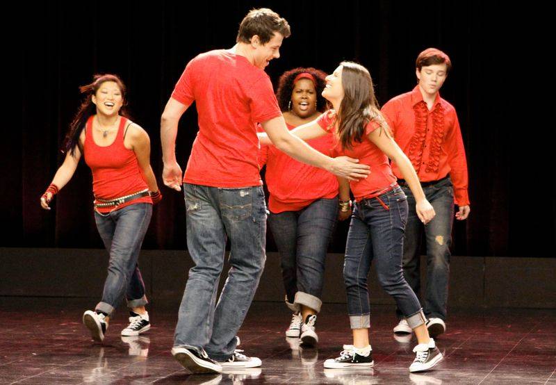 Image may contain: Cory Monteith, Amber Riley, Lea Michele, Clothing, Pants, Jeans, Footwear, Shoe, and Dancing