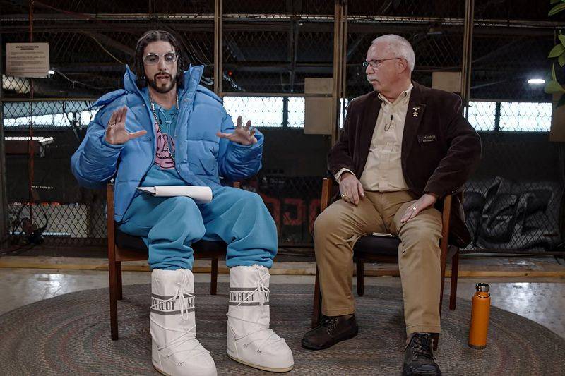Image may contain: Sacha Baron Cohen, Ramachandra Naidu Galla, Conversation, Person, Sitting, Adult, and Interview